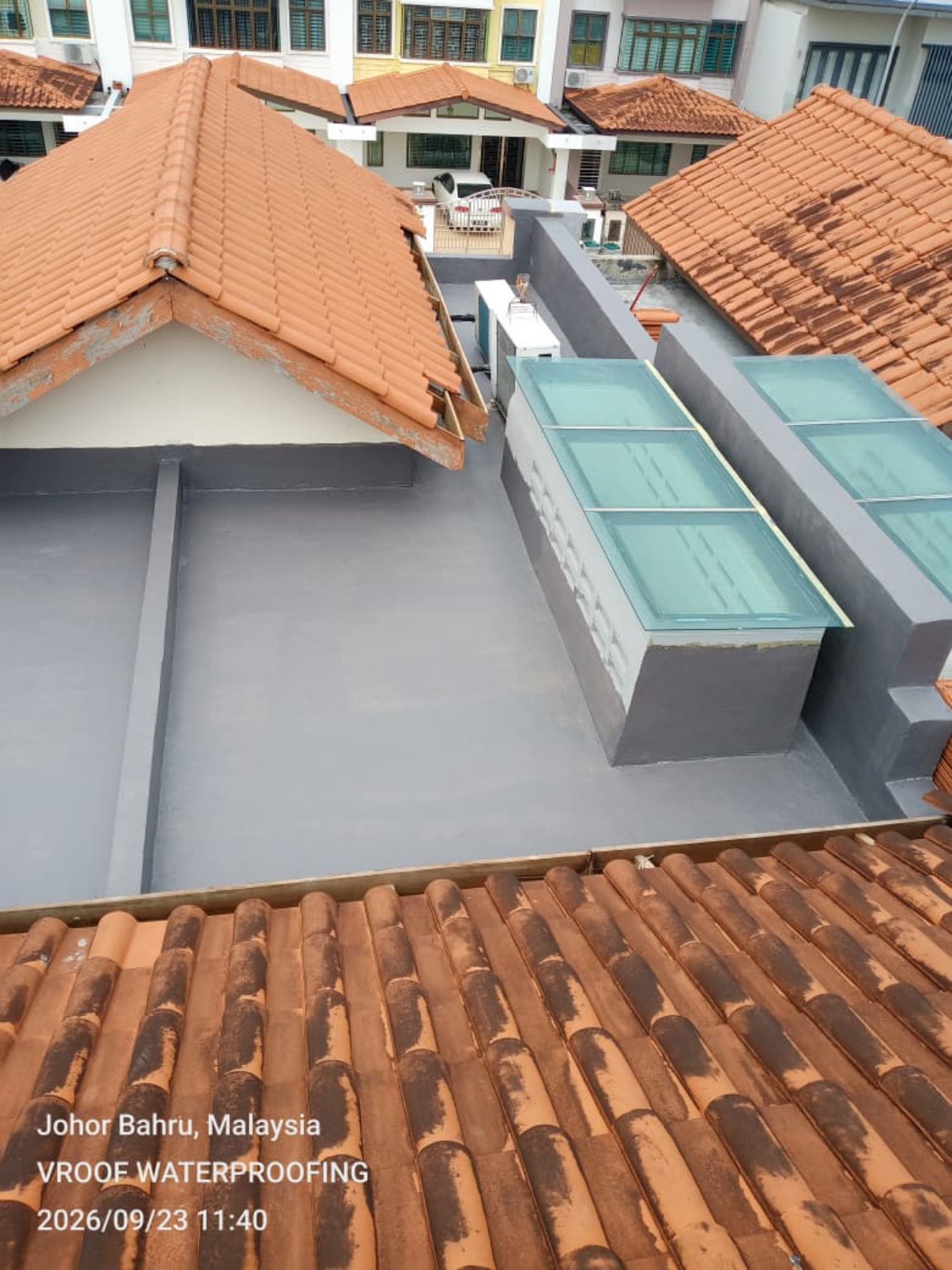 Completed surface waterproofing on a concrete roof slab.