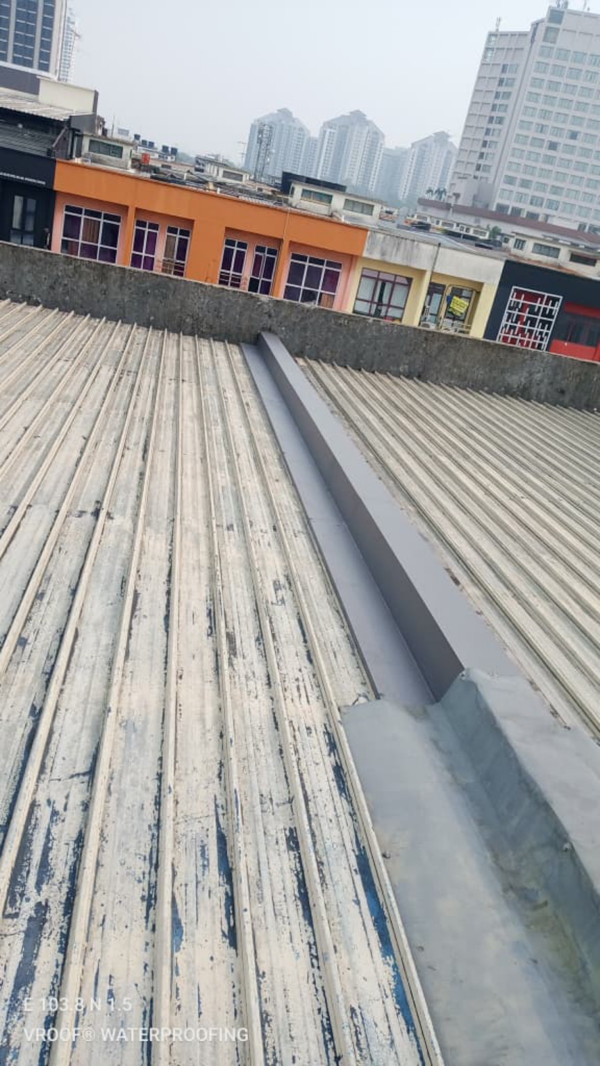 Treatment at a roof junction; this photograph illustrates the junction repair part of the service.
