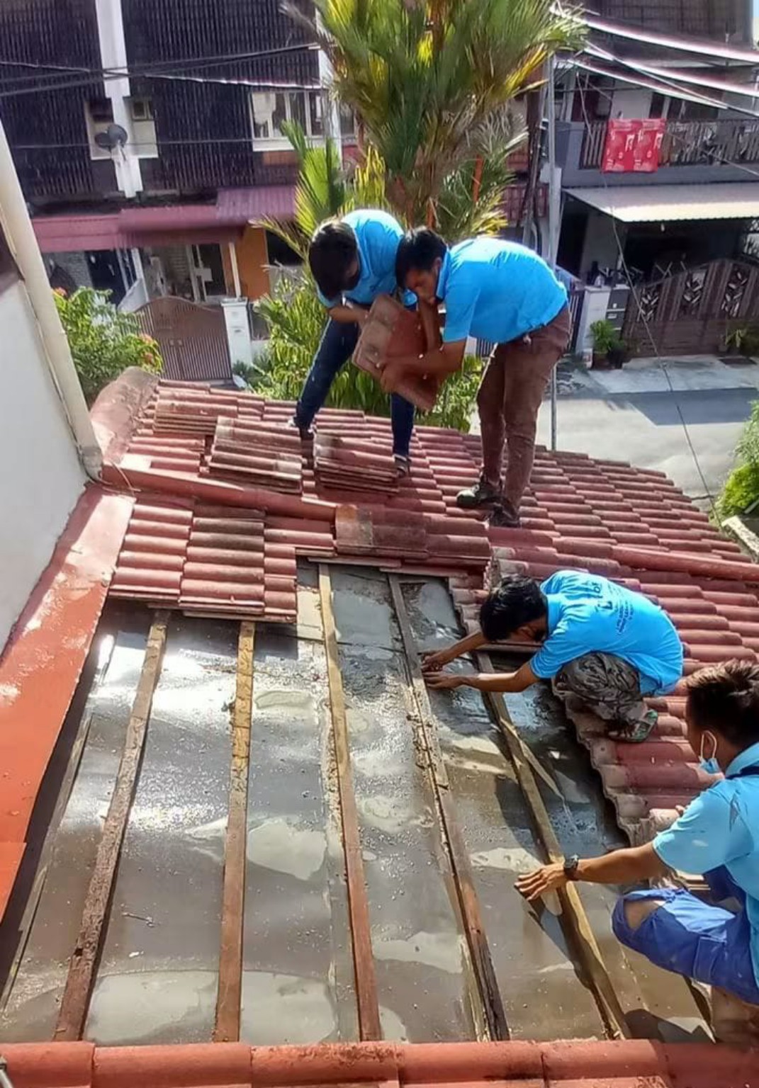 Roof tile repair work in progress.